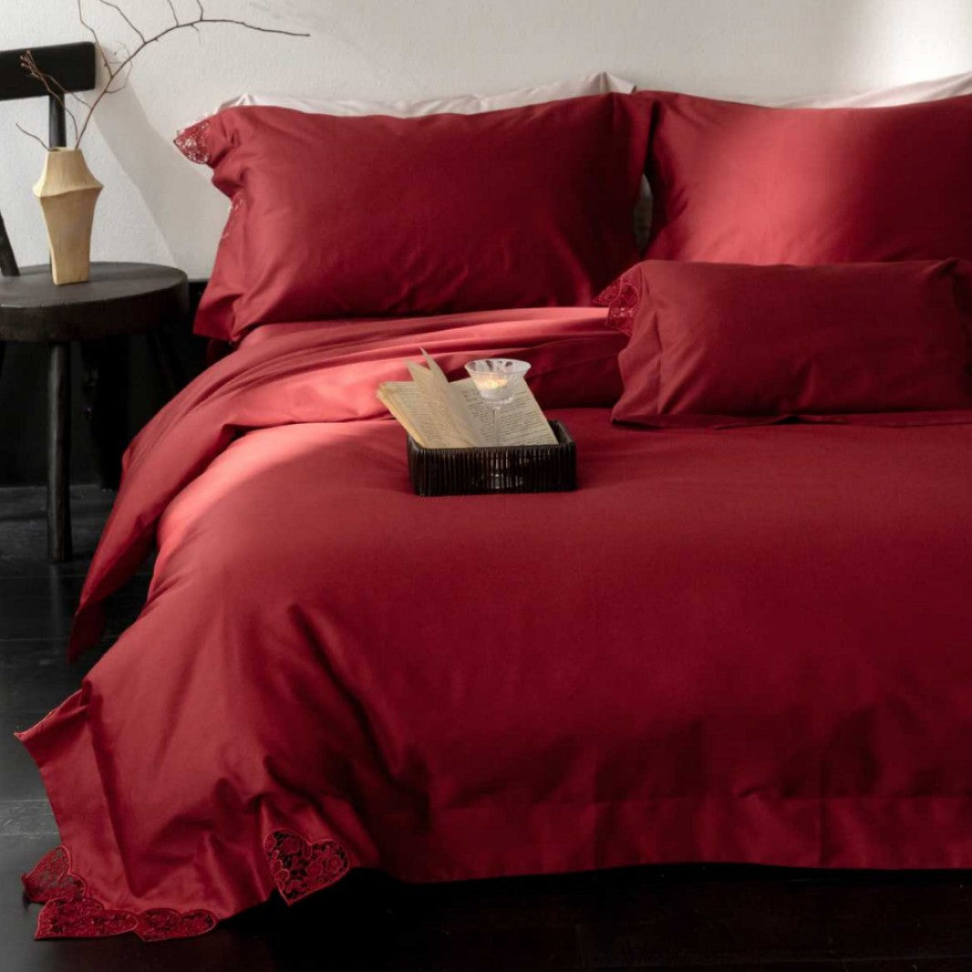 Satin bedding set with lace heart appliqué