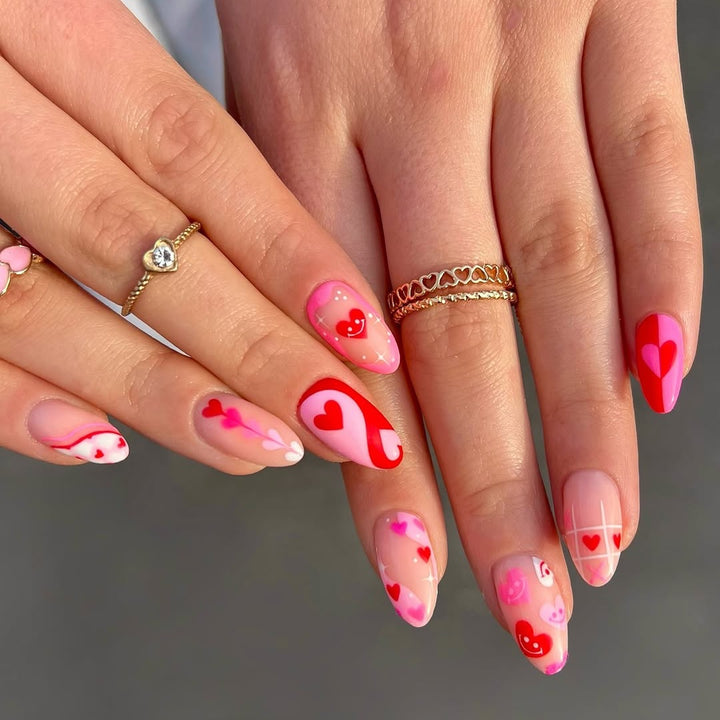 Acrylic nail set with romantic heart motifs and modern designs Stornfield