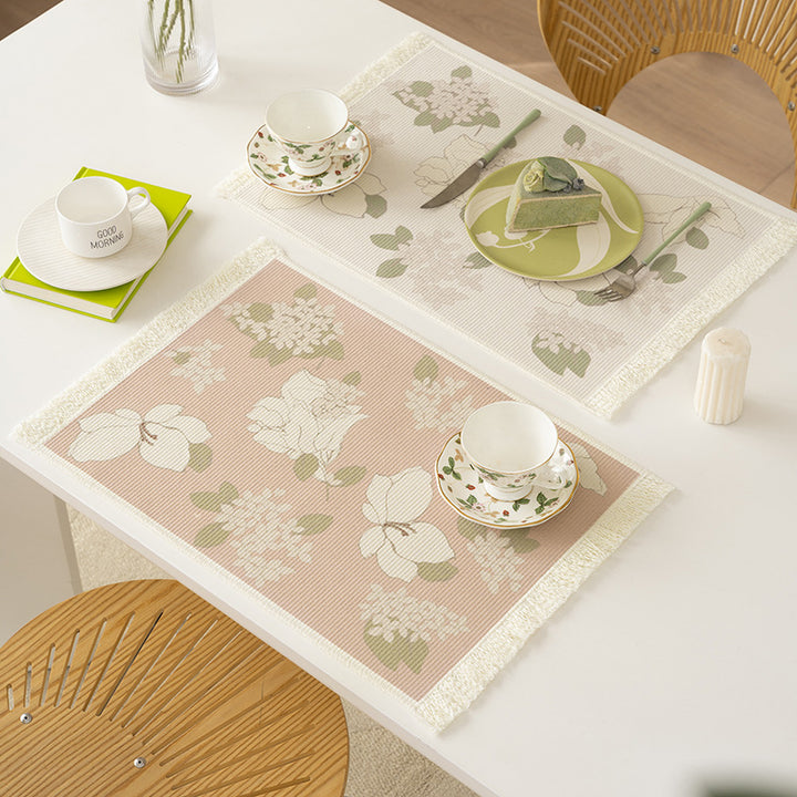 Woven table placemat made of cotton blend with olive branch print and decorative fringe edge