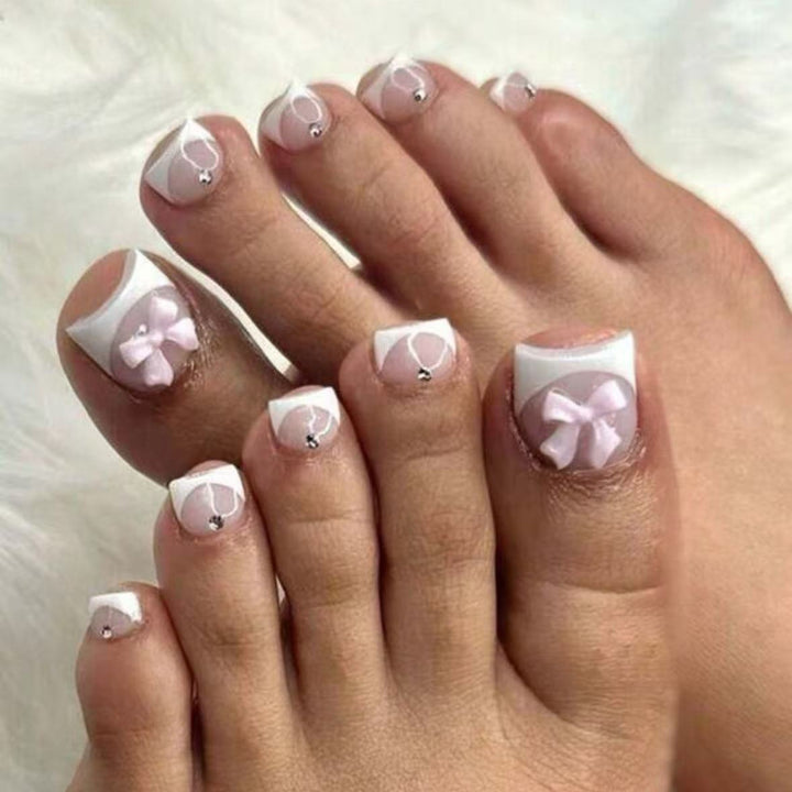Nail art set with elegant French design and romantic bows Stornfield