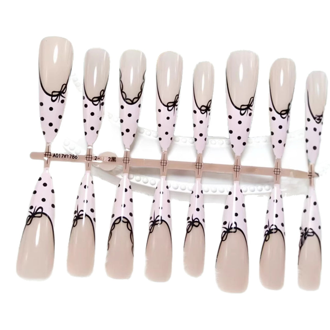 Elegant artificial nails with bow design and dots Stornfield