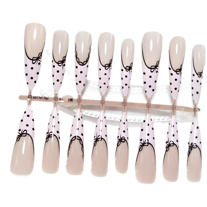 Elegant artificial nails with bow design and dots Stornfield