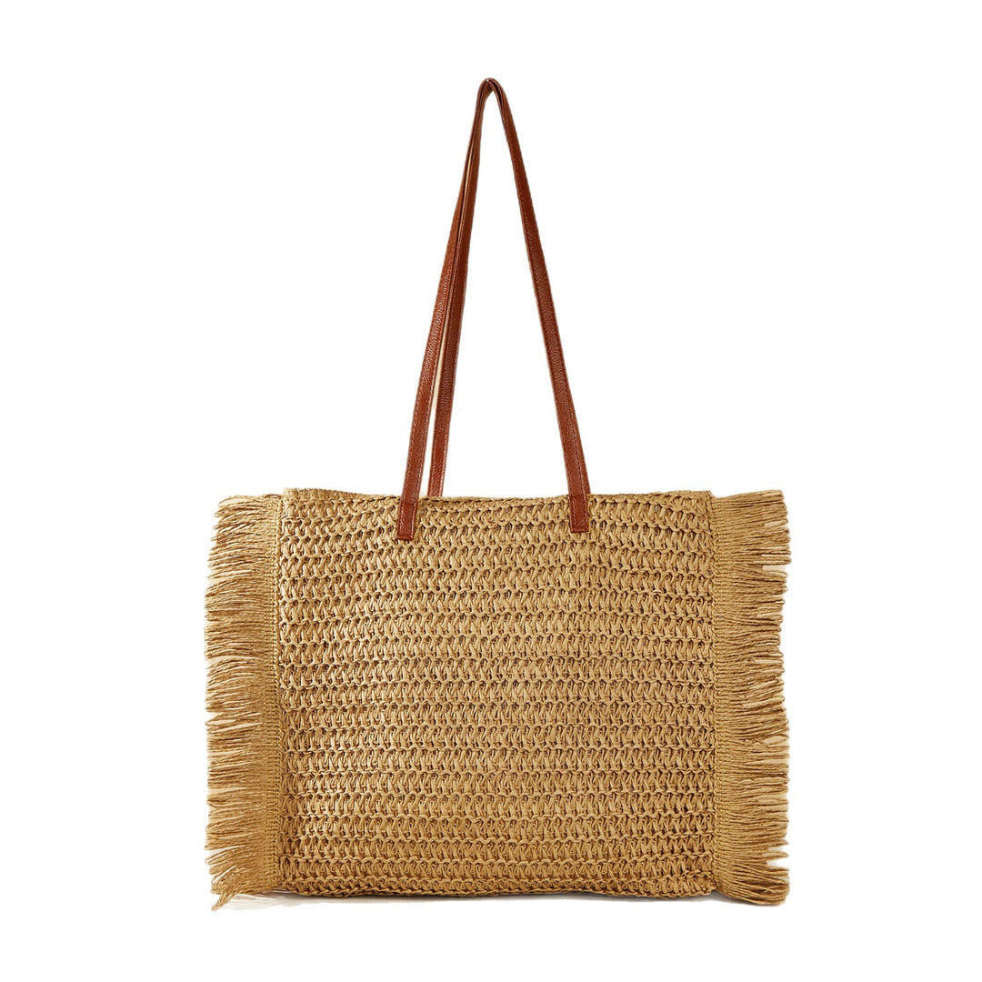 Beach bag made of raffia with fringed details Stornfield