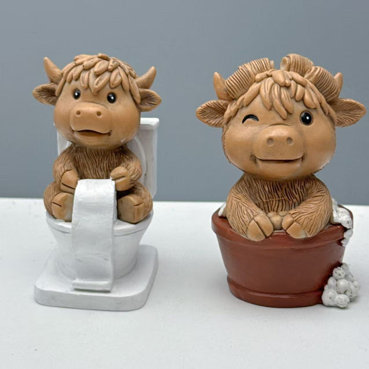 Funny decorative figure of a Highland cow on toilet Stornfield