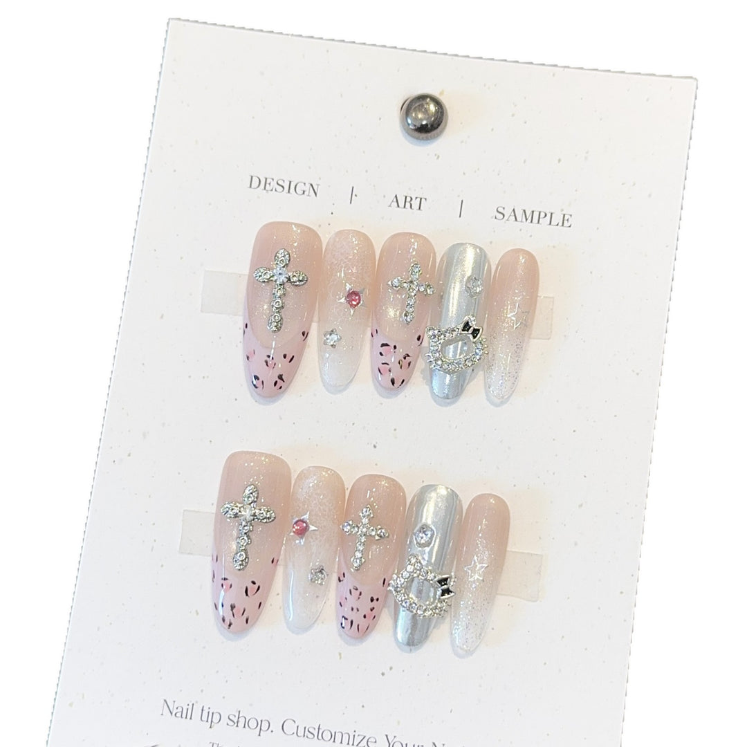 Artificial nails with sparkling rhinestones and cross motifs Stornfield