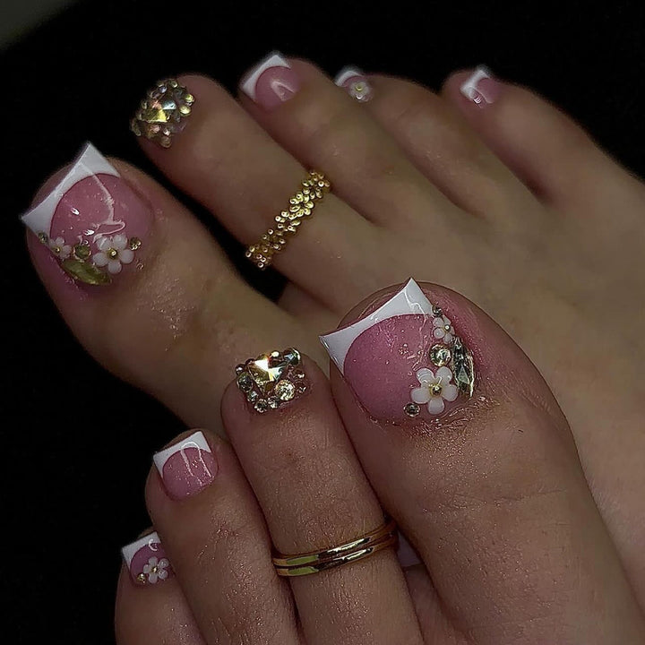 Artistic toenail art with elegant flower and glitter accents Stornfield