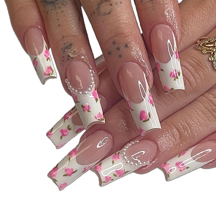 Artificial nail set with floral designs and elegant decorations Stornfield