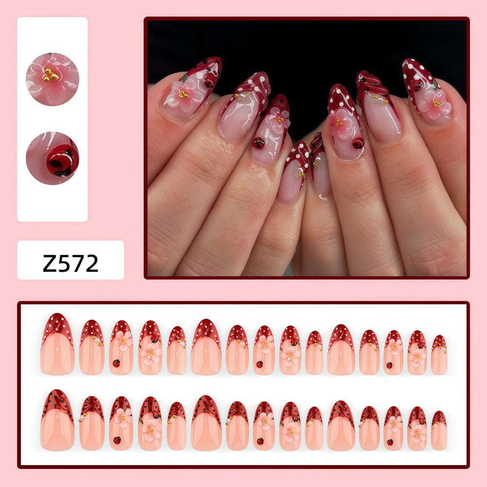 Artificial nails with floral design and 3D accents Stornfield