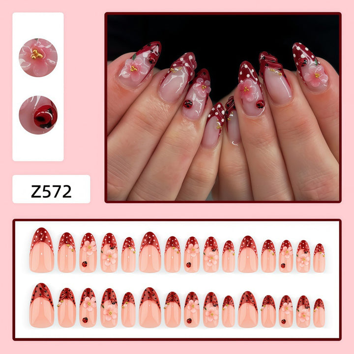 Artificial nails with floral design and 3D accents Stornfield