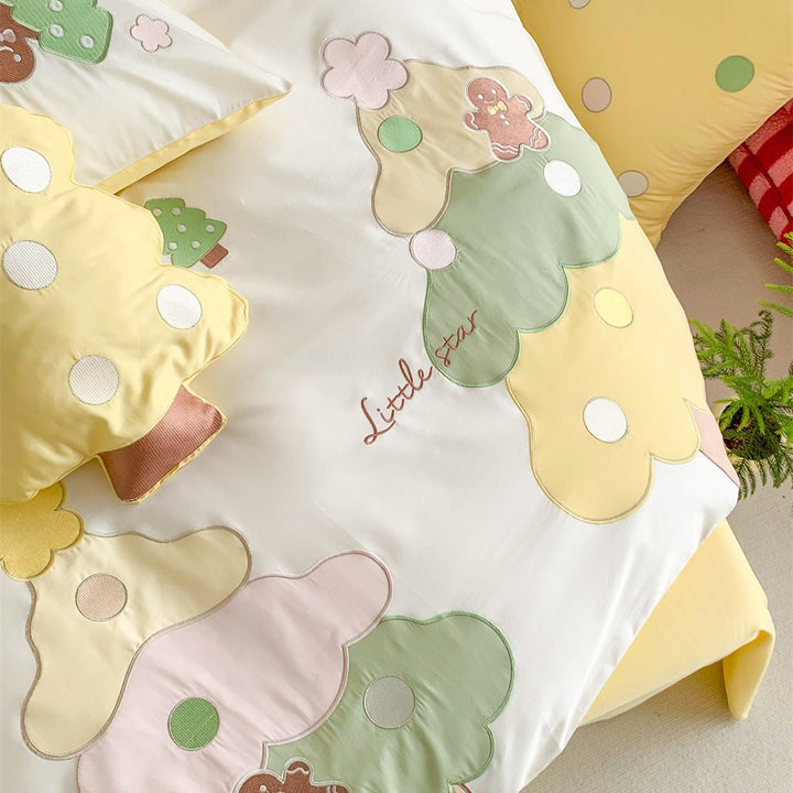 Children's bedding set with playful tree appliqués and soft pillowcases