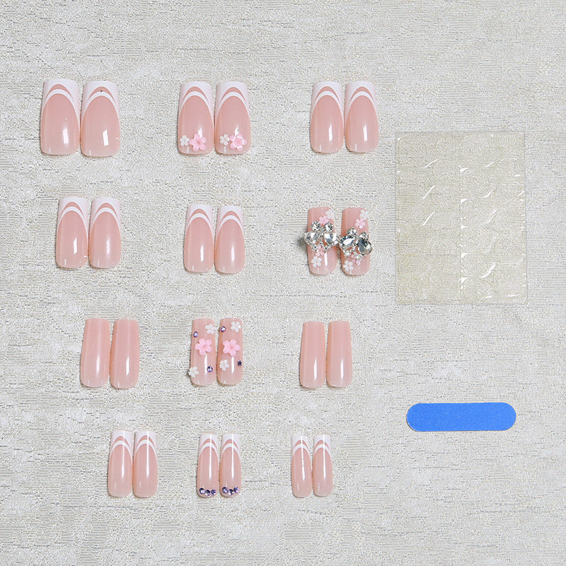 Artificial nails with floral accents and glitter effects Stornfield