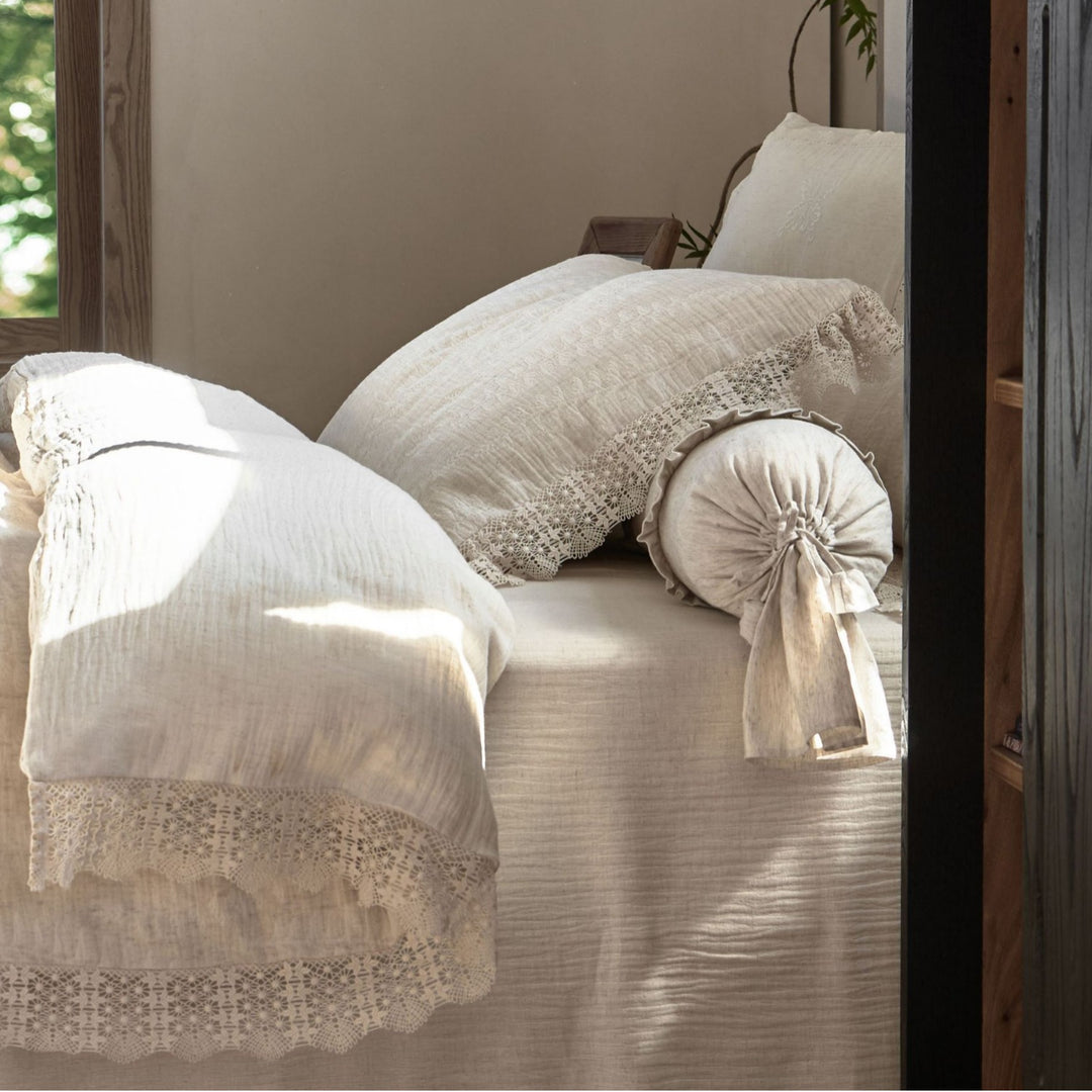 Natural linen bedding set with lace edge and decorative neck roll