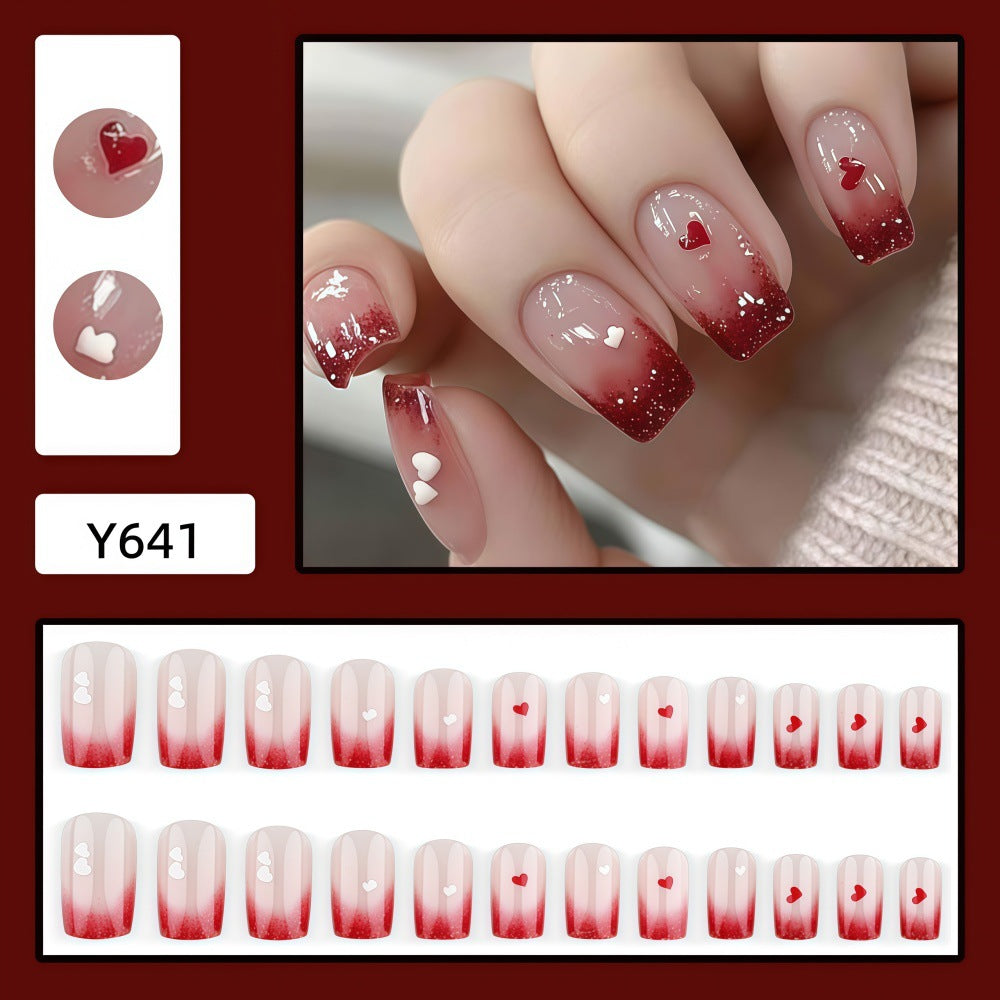 Romantic Nail Art with Heart Motifs Stornfield
