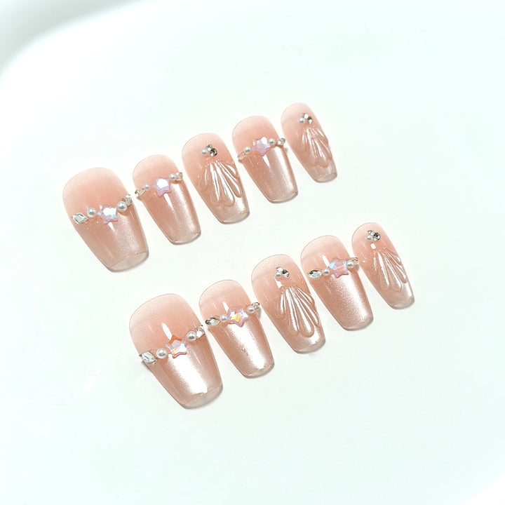 Exquisite artificial nails with glitter and pearl accents Stornfield