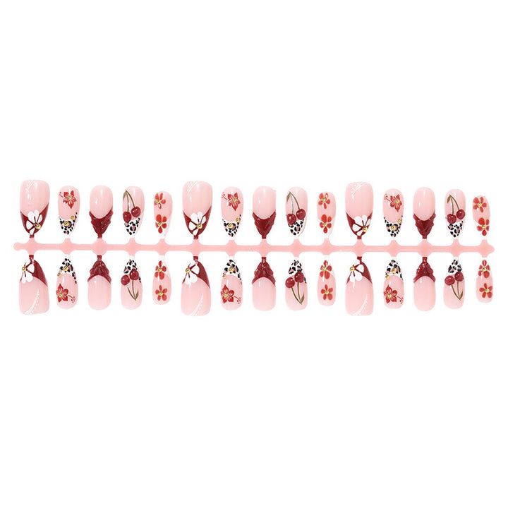 Artificial nail set with floral 3D designs and elegant accents Stornfield
