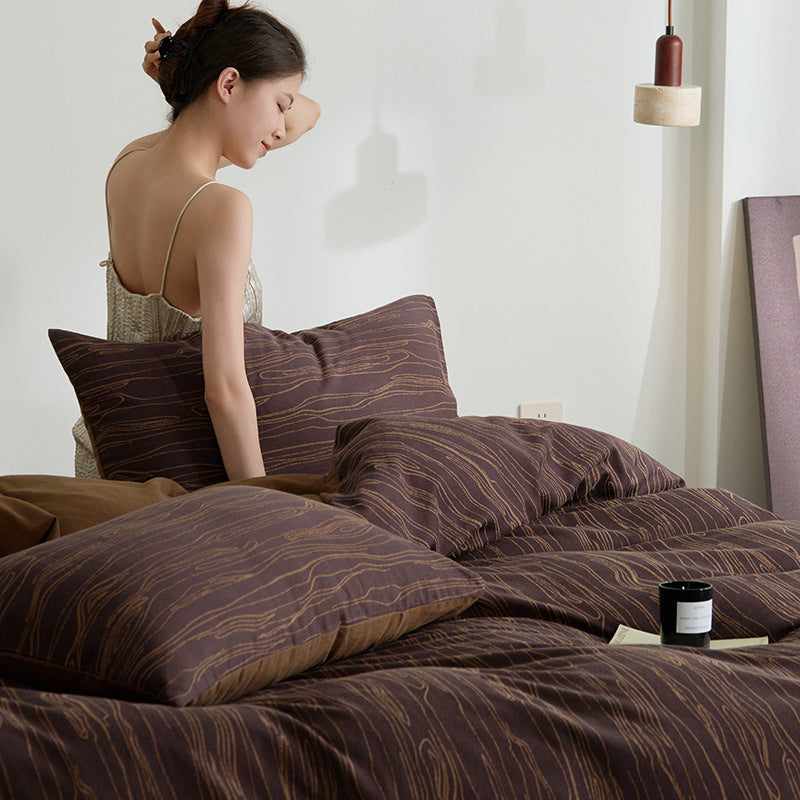 Modern bedding set made of cotton percale with organic stain pattern
