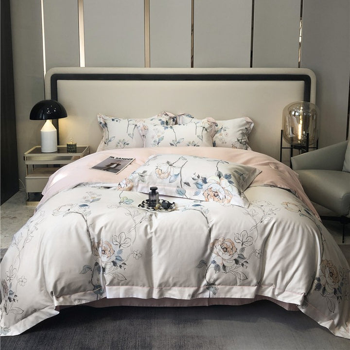 Cotton satin bedding set with watercolor flower print and reversible blanket