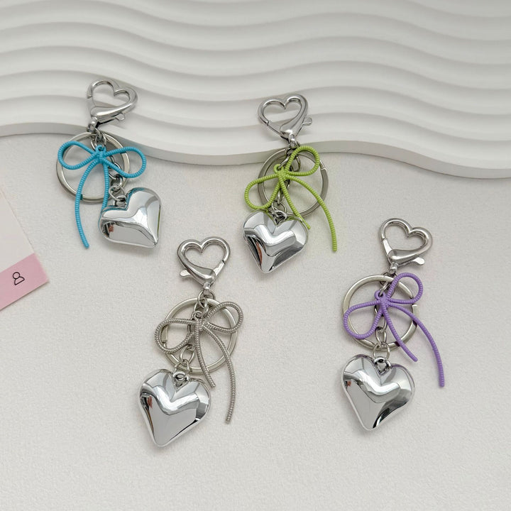 Heart-Shaped Metallic Keychain with Decorative Bow Stornfield