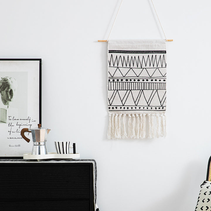 Woven Boho wall hanging with fringes and graphic ethnic pattern Stornfield