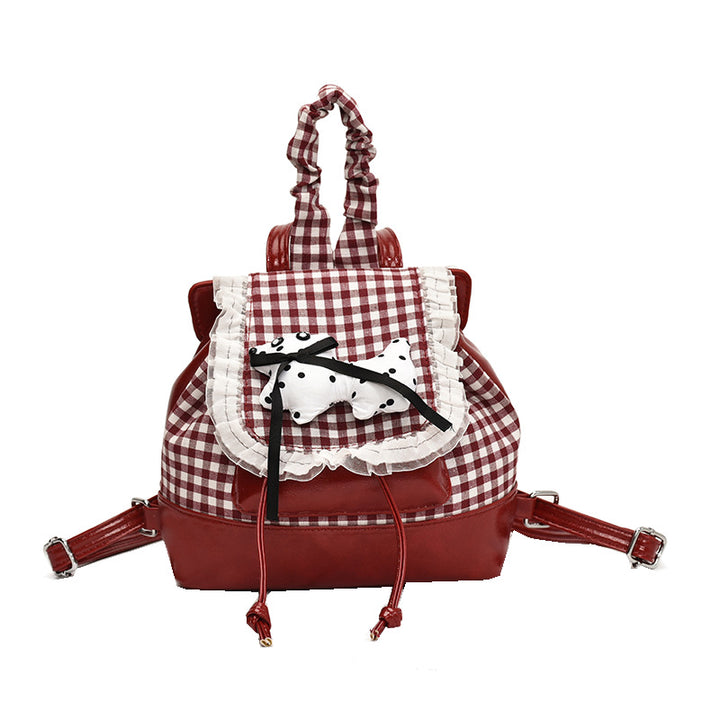 Playful backpack with checkered pattern and animal appliqué Stornfield