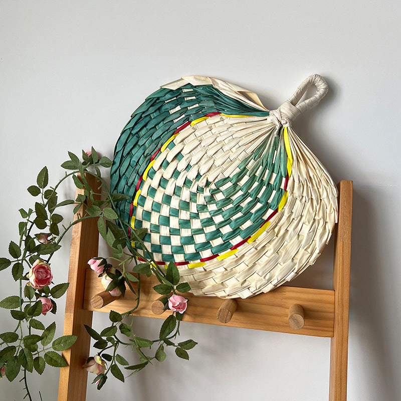 Women hand-woven fan made of natural material Stornfield