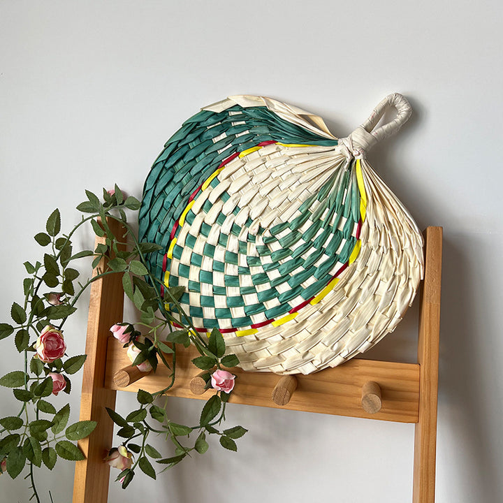 Women hand-woven fan made of natural material Stornfield