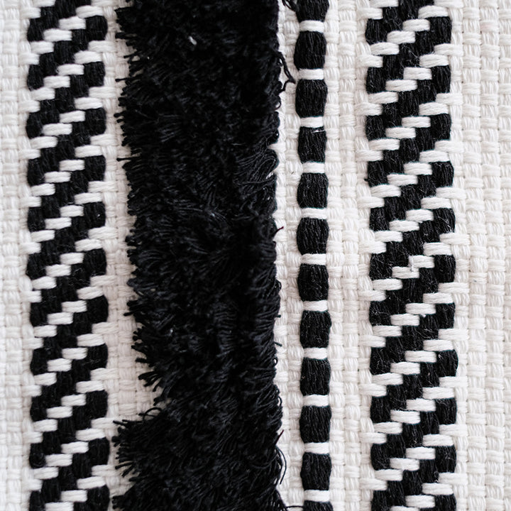 Structured living room carpet with 3D tufting and geometric diamond relief