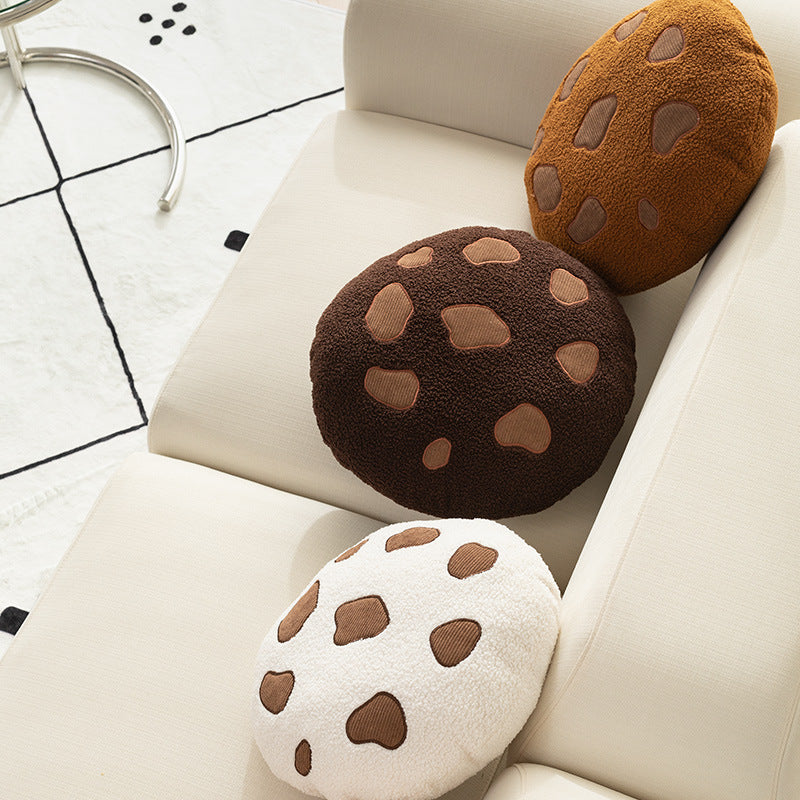 Round cuddle seat cushion with teddy fleece and abstract patch appliqués Stornfield