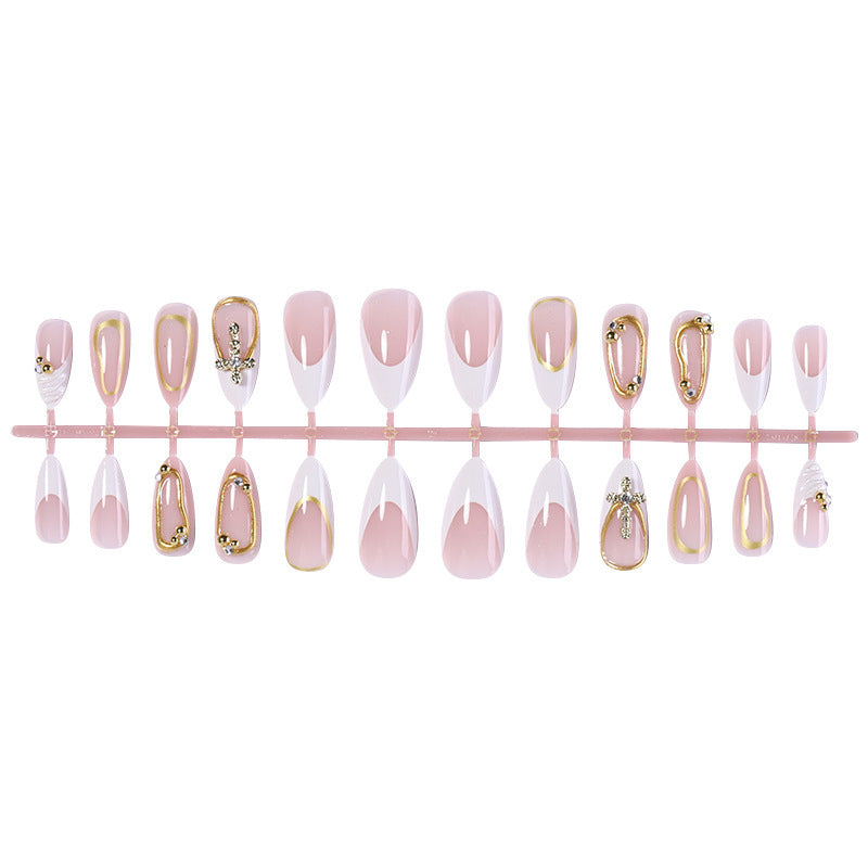 Artificial nail set with luxurious gold embellishments and elegant designs Stornfield