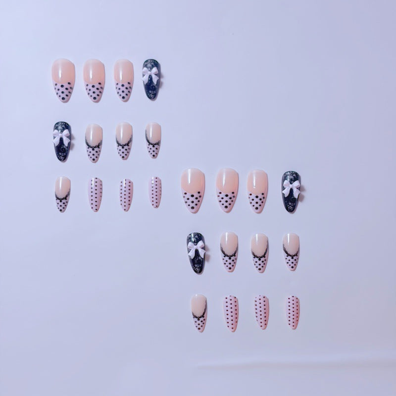 Elegant artificial nails with lace design and bow accents Stornfield