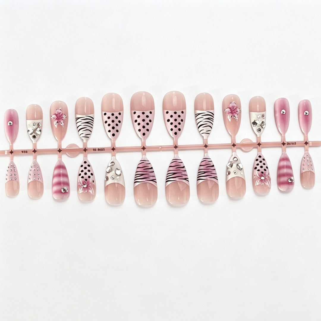 Artistic Press-On Nail Design with Unique Patterns and Rhinestone Accents Stornfield