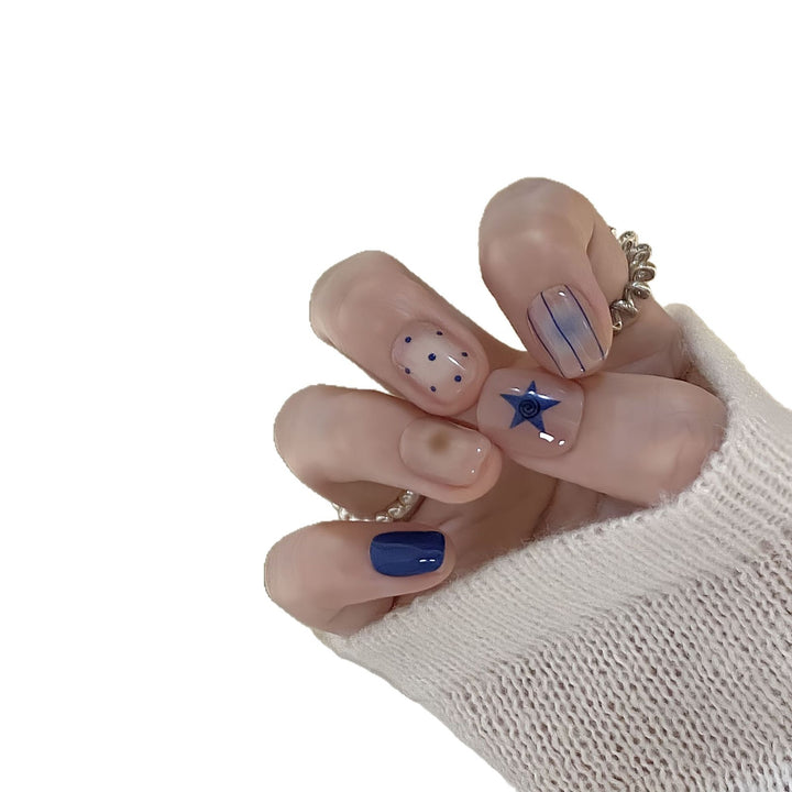 Artificial nails in modern design with geometric and sparkling accents Stornfield