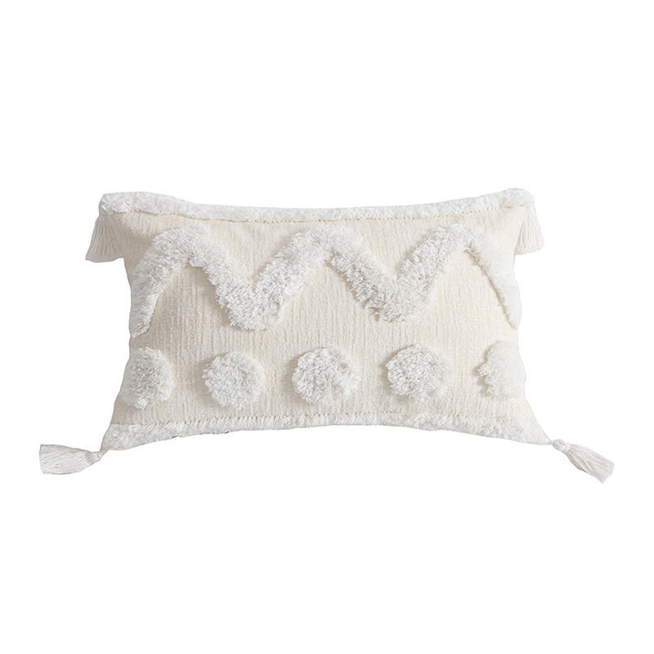 Rectangular decorative cushion cover with hand-tufted chevron and pompom relief as well as corner tassels Stornfield
