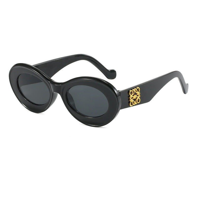 Women's fashionable sunglasses with oval frame and golden applications Stornfield