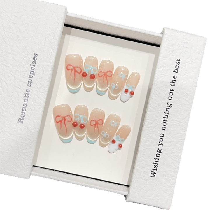 Artificial nail tips with romantic bow and cherry motifs Stornfield
