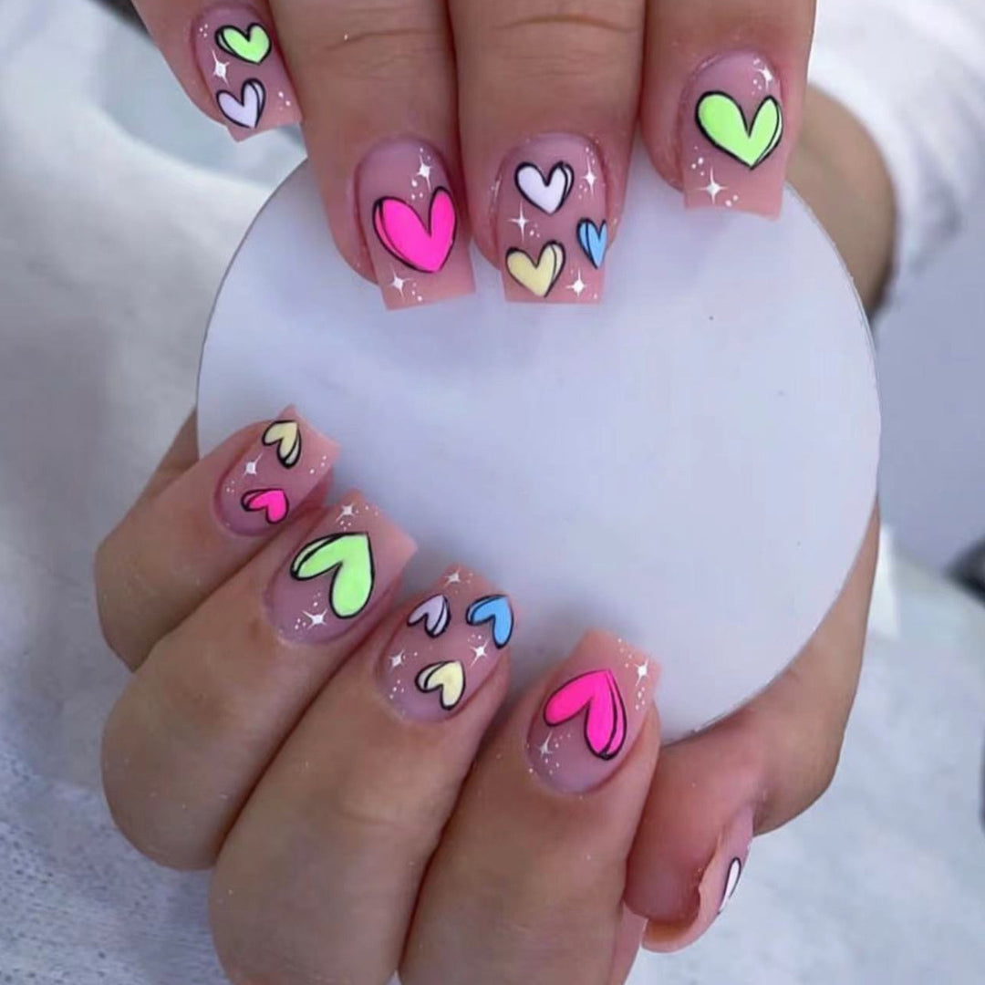 Artificial nail set with playful heart patterns Stornfield