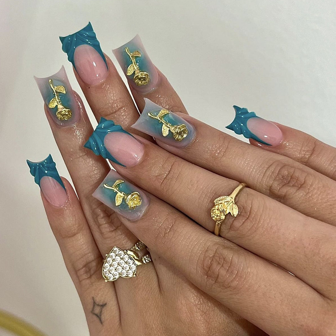 Elegant artificial nail creations with golden embellishments Stornfield