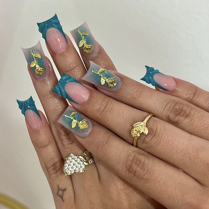 Elegant artificial nail creations with golden embellishments Stornfield