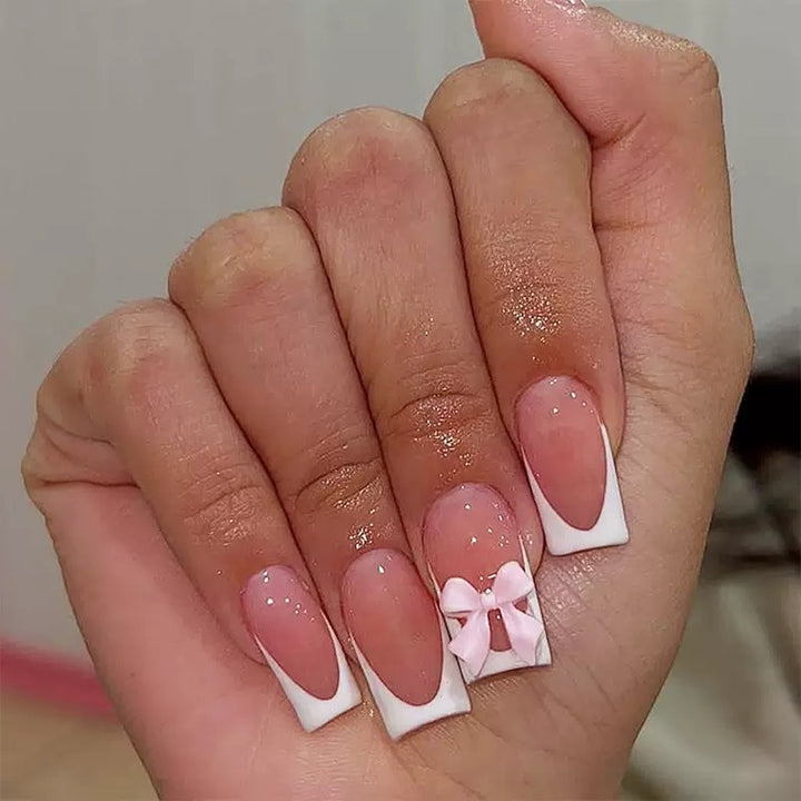 Nail set with playful bow design Stornfield