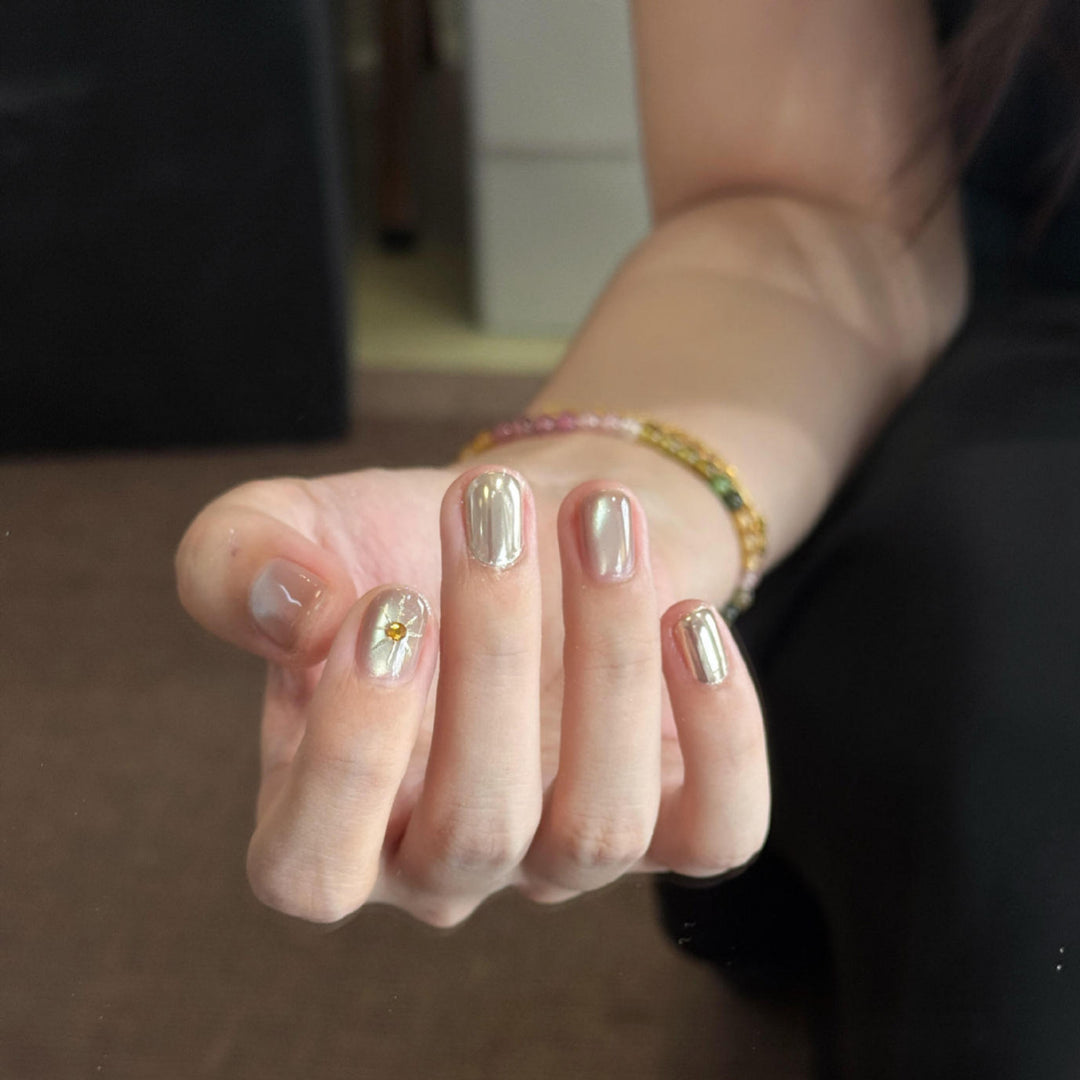 Artificial nails with luxurious metallic finish and sparkling accent Stornfield