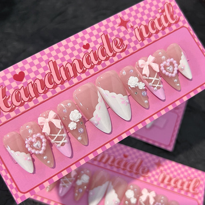 Artful stiletto nails with romantic accents Stornfield