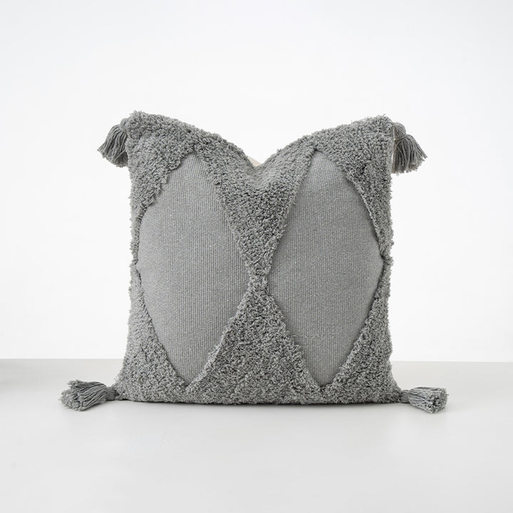 Square cushions with structured boucle look, quilted tufting and decorative tassels