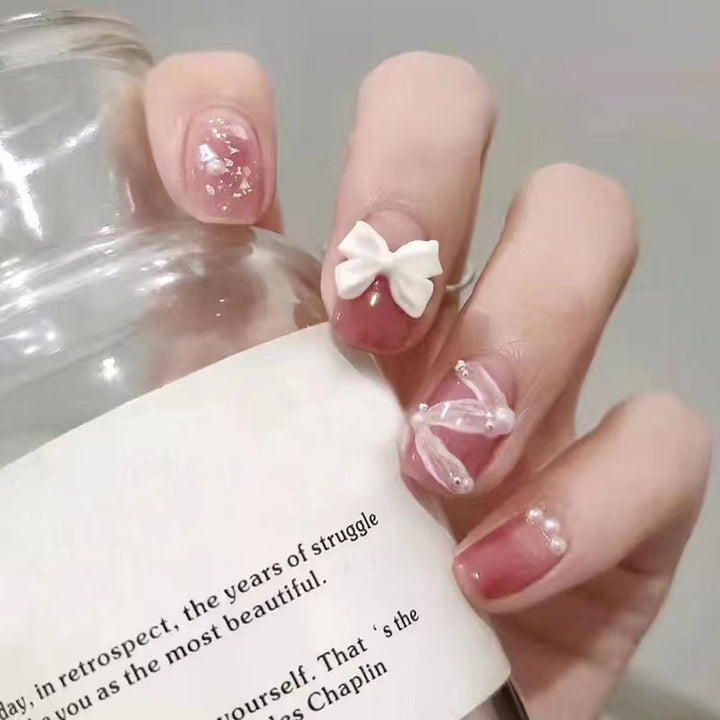 Creative art nails with bows and pearl coating Stornfield