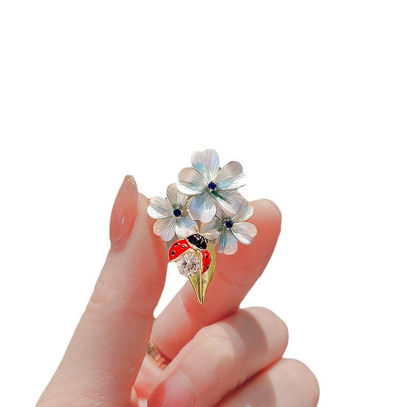 Flower brooch with ladybug and crystal Stornfield
