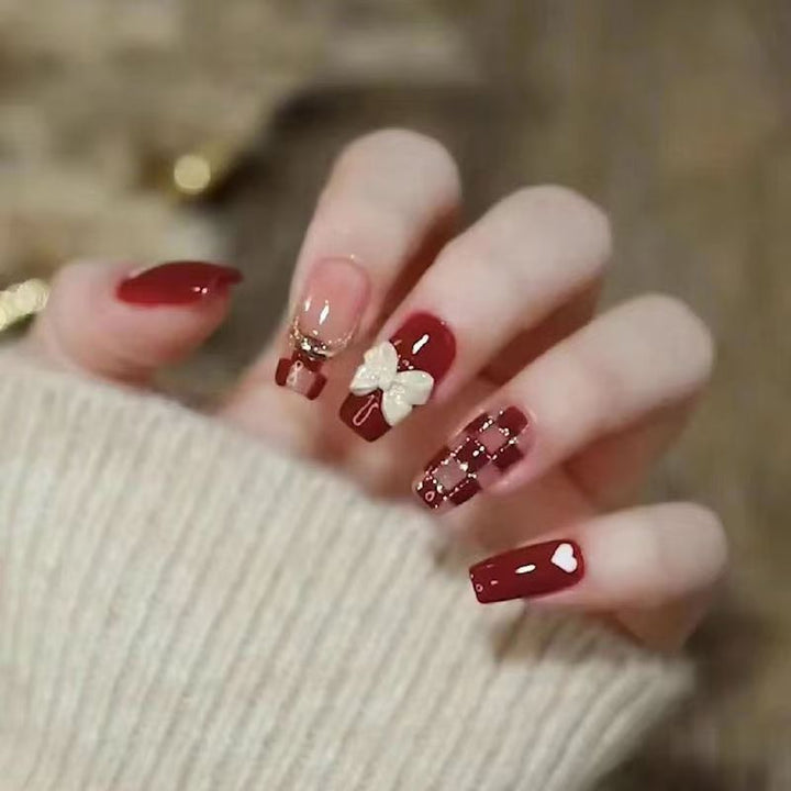 Artificial nails with decorative heart and bow details Stornfield