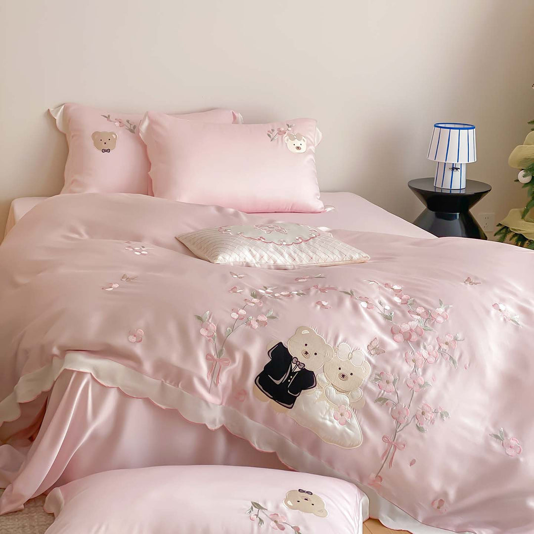 Satin bedding set with embroidered wedding bears, ruffled hem & decorative pillows