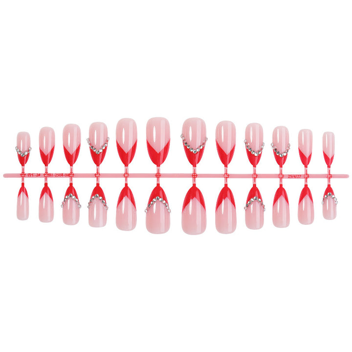 Nail art set with elegant red accents and rhinestone embellishments Stornfield