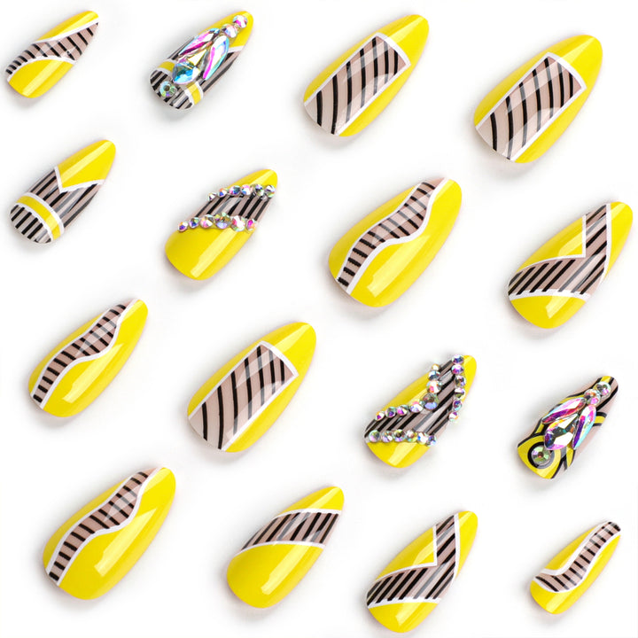 Artful nail extensions with geometric design and glitter accents Stornfield