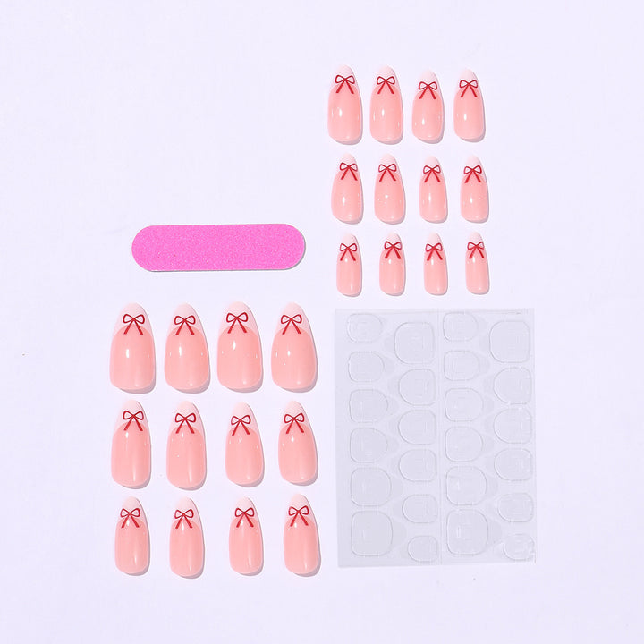Artificial nail set with playful bow design Stornfield
