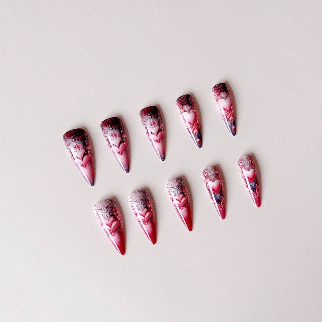 Artificial nail set with romantic 3D heart designs and luxurious embellishments Stornfield